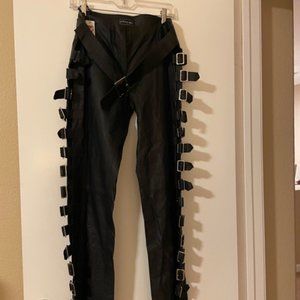 Women's black leather pants with buckles